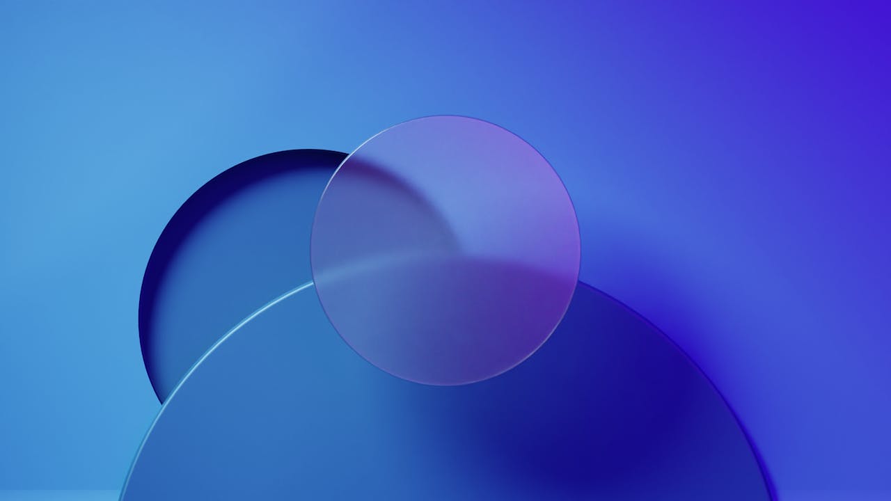 Abstract blue and purple 3D geometric composition with translucent circular shapes, symbolizing modern digital design