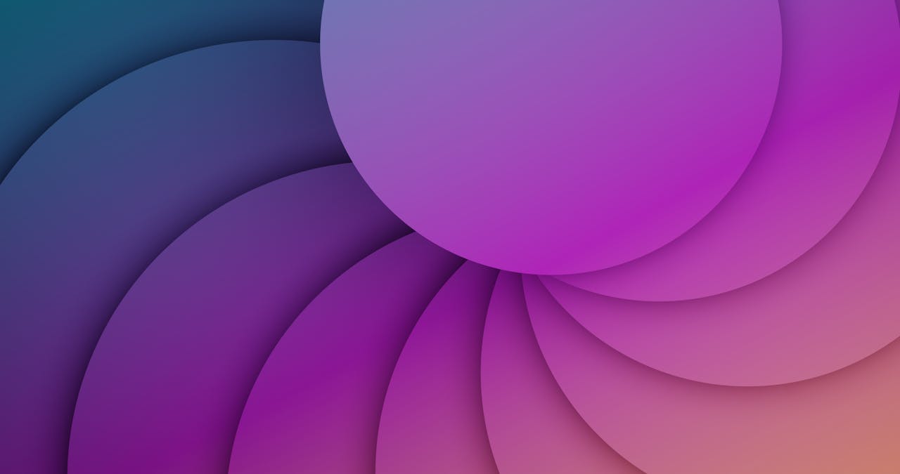 Abstract layered circles in vibrant purple, pink, and orange gradients forming a flowing geometric design